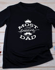 Fathers Day Most Amazing DAD – New Dad Gift from Baby – Cool Graphic Tee – First Fathers Day Present – Gift for Him
