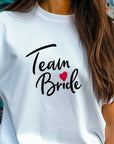 Team Bride Shirt – Festive Wedding Party T-Shirt – Bachelorette Party Tee – Matching Bridal Squad Shirts – Bride Tribe Gift Idea